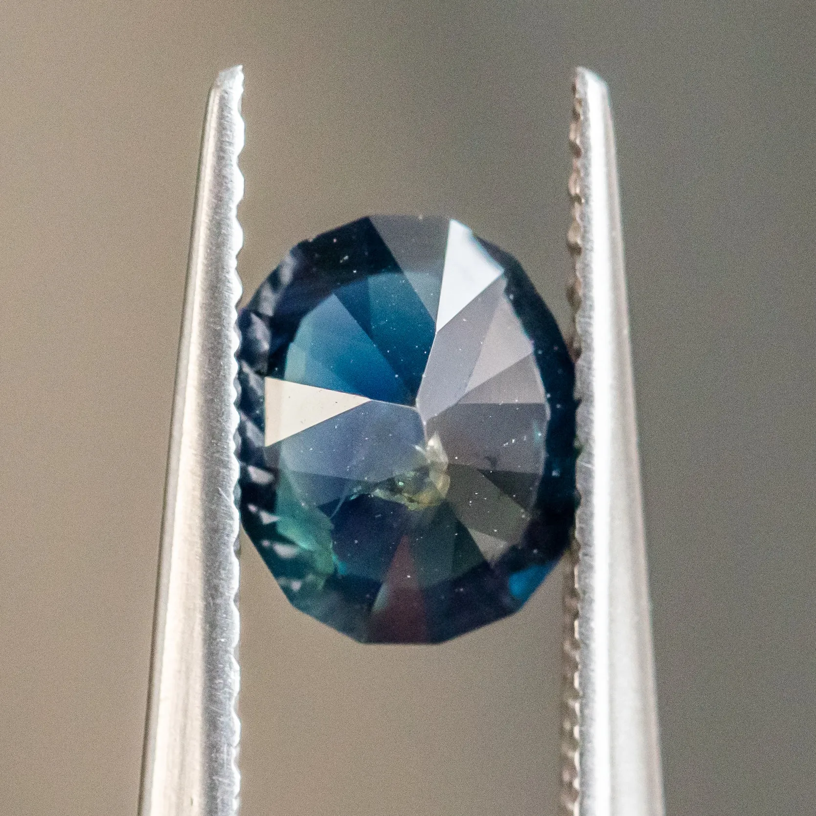 1.25CT OVAL NIGERIAN SAPPHIRE, DEEP BLUE GREEN, 7.13X6.09X3.81MM, UNTREATED