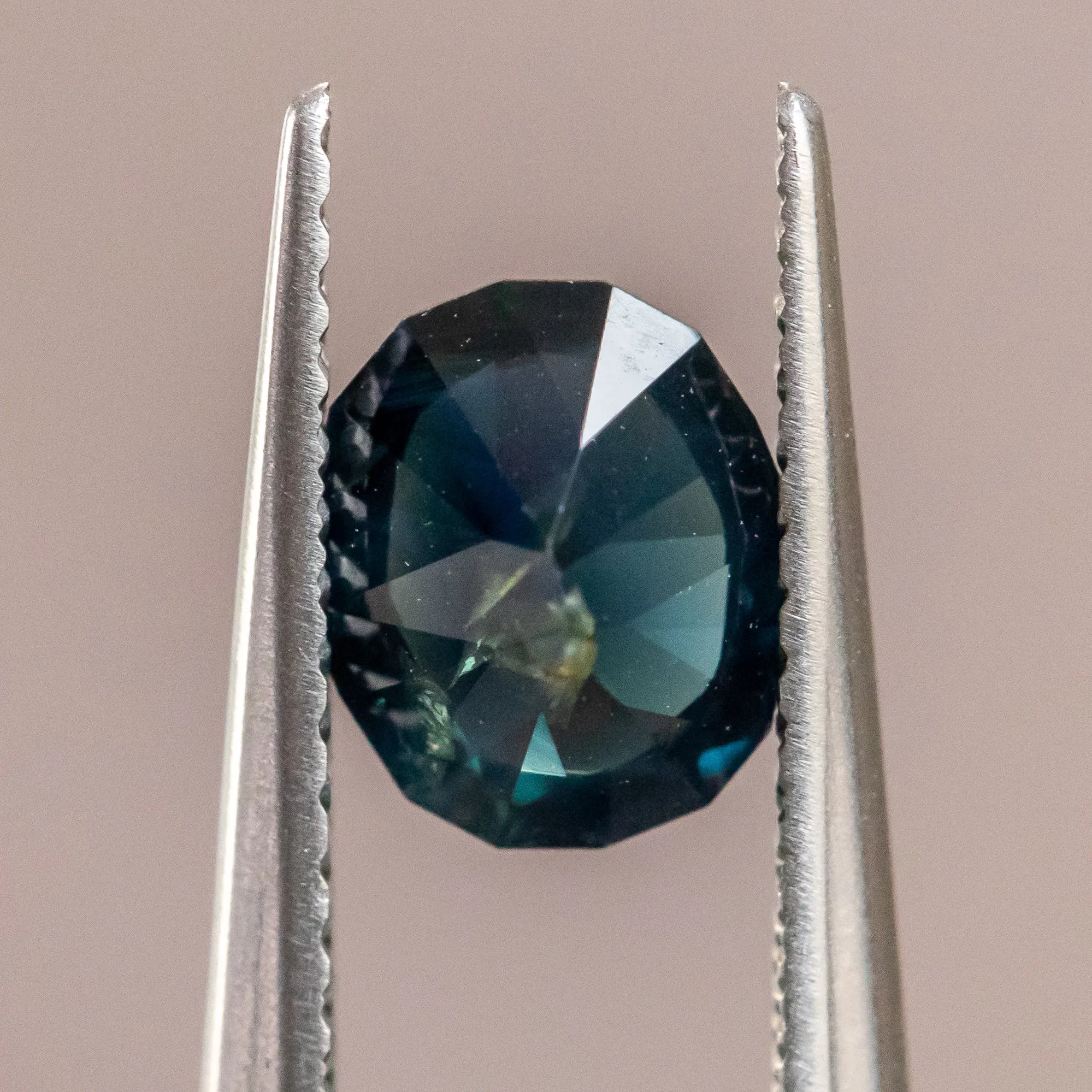 1.25CT OVAL NIGERIAN SAPPHIRE, DEEP BLUE GREEN, 7.13X6.09X3.81MM, UNTREATED