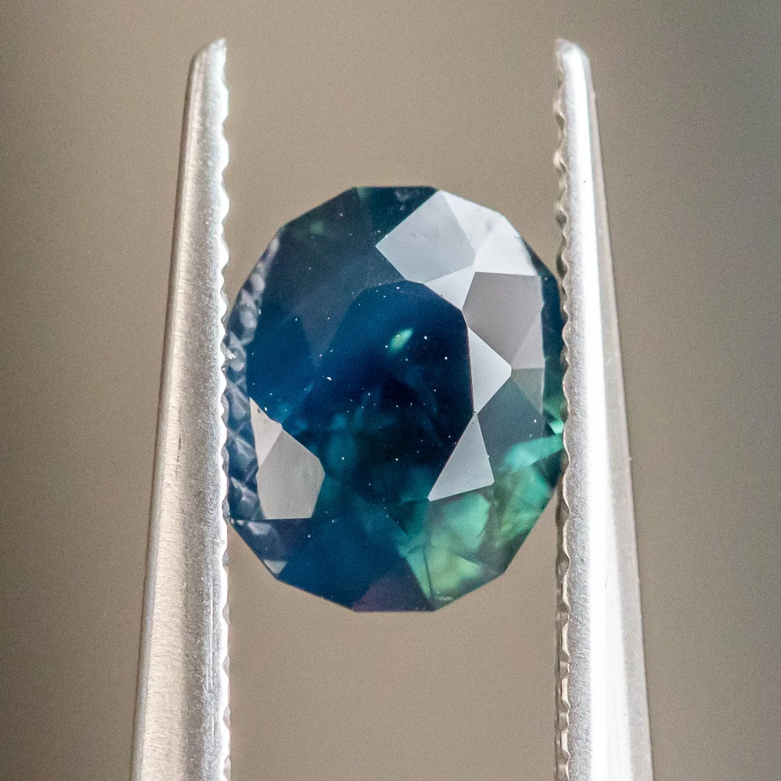 1.25CT OVAL NIGERIAN SAPPHIRE, DEEP BLUE GREEN, 7.13X6.09X3.81MM, UNTREATED